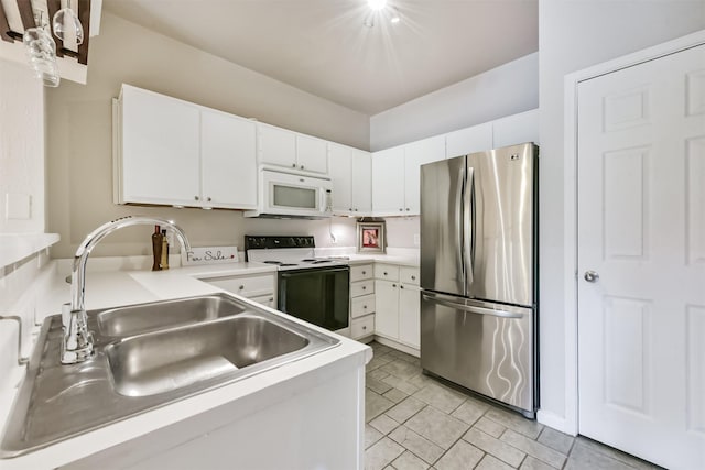1330 Old Spanish Trl Unit 1210, Houston, TX 77054 - kitchen with freestanding refrigerator, white microwave, electric range oven, and light countertops