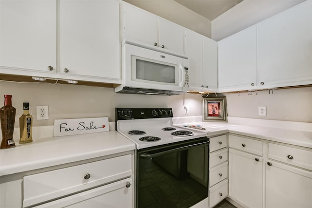 1330 Old Spanish Trl Unit 1210, Houston, TX 77054 - kitchen with electric range, white microwave, white cabinets, and light countertops