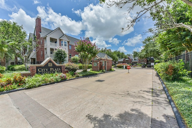 1330 Old Spanish Trl Unit 1210, Houston, TX 77054 - view of concrete road with curbs, a residential view, and traffic signs