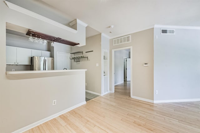 1330 Old Spanish Trl Unit 1210, Houston, TX 77054 - empty room with wood finished floors, built in shelves, and ornamental molding