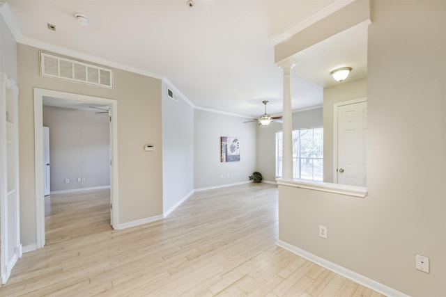 1330 Old Spanish Trl Unit 1210, Houston, TX 77054 - empty room with a ceiling fan, crown molding, decorative columns, and light wood finished floors