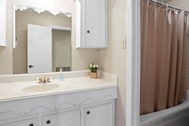 2306 Westfield St, Alvin, TX 77511 - bathroom with vanity and shower / bath combination with curtain