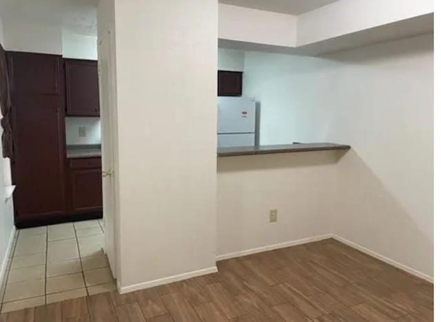 10555 Turtlewood Ct Unit 2303, Houston, TX 77072 - hall with wood finished floors and baseboards