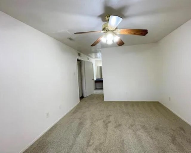 10555 Turtlewood Ct Unit 2303, Houston, TX 77072 - empty room featuring light carpet and a ceiling fan