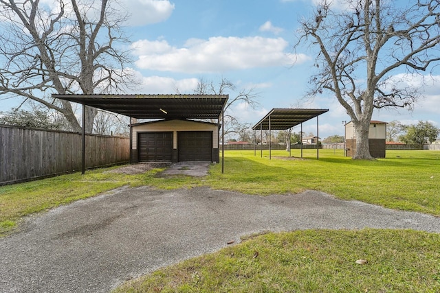 5302 Pine Ave, Pasadena, TX 77503 - view of car parking featuring a detached garage and a carport