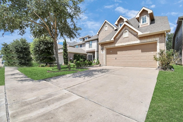 14710 Branchwest Dr, Houston, TX 77082 - view of front of home featuring brick siding, driveway, a front lawn, and roof with shingles