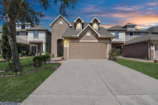 14710 Branchwest Dr, Houston, TX 77082 - view of front facade featuring brick siding, concrete driveway, an attached garage, and a yard