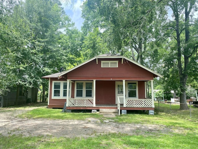 212 Harding Ave, Cleveland, TX 77327 - view of front facade featuring a porch