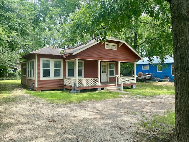 212 Harding Ave, Cleveland, TX 77327 - view of front of house featuring a porch