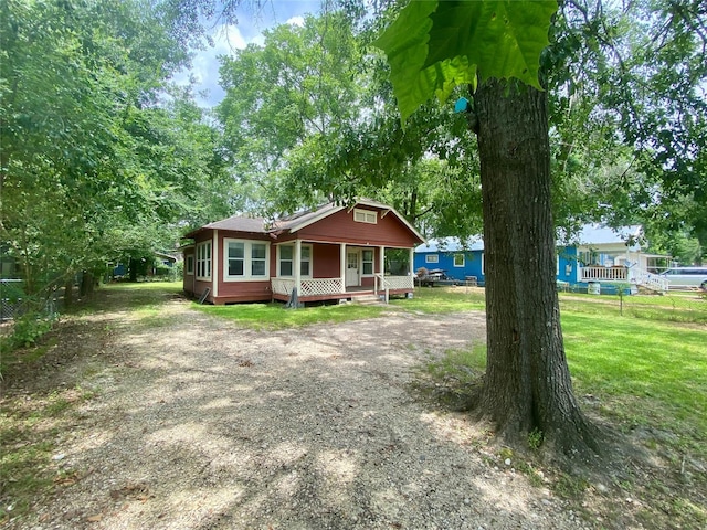 212 Harding Ave, Cleveland, TX 77327 - view of front facade with covered porch