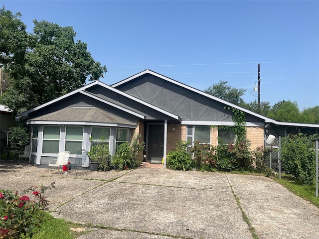 11733 Knotty Pine Trl, Houston, TX 77050 - view of front facade featuring brick siding and a shingled roof