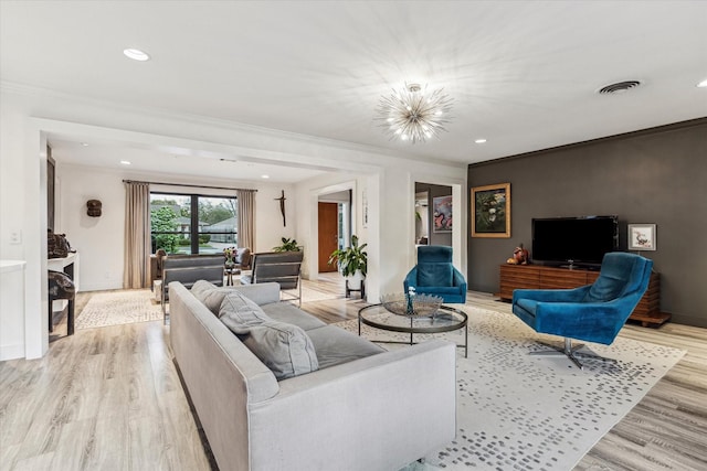 9718 Checkerboard St, Houston, TX 77096 - living area featuring light wood-style flooring, a chandelier, ornamental molding, and recessed lighting