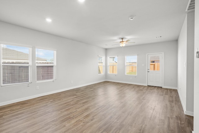 316 Amy St, Angleton, TX 77515 - spare room featuring ceiling fan, plenty of natural light, wood finished floors, recessed lighting, and a smoke detector