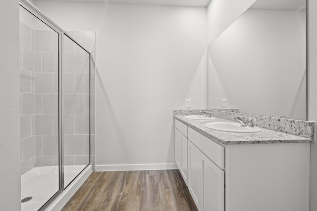 316 Amy St, Angleton, TX 77515 - full bath with a stall shower, wood finished floors, and double vanity