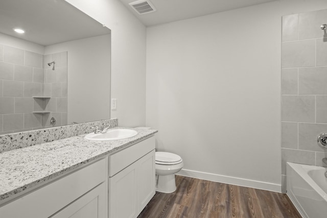 316 Amy St, Angleton, TX 77515 - full bath featuring vanity, wood finished floors, washtub / shower combination, and recessed lighting