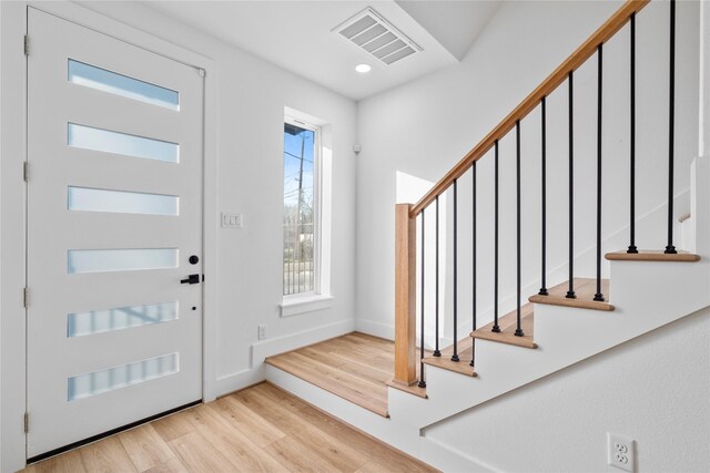 6907 Conley St, Houston, TX 77021 - foyer entrance with wood finished floors, stairs, and recessed lighting