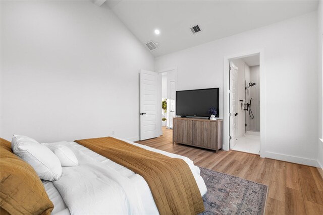 6907 Conley St, Houston, TX 77021 - bedroom with high vaulted ceiling, light wood-type flooring, recessed lighting, and ensuite bathroom
