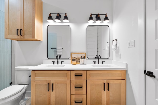 6907 Conley St, Houston, TX 77021 - bathroom featuring double vanity and toilet
