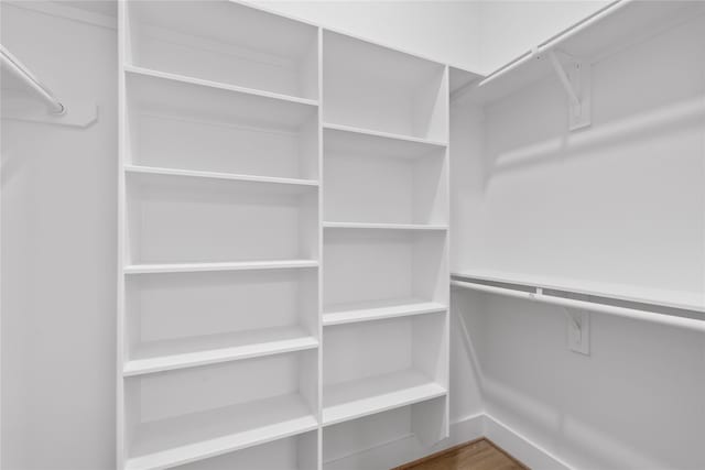 6907 Conley St, Houston, TX 77021 - walk in closet with wood finished floors