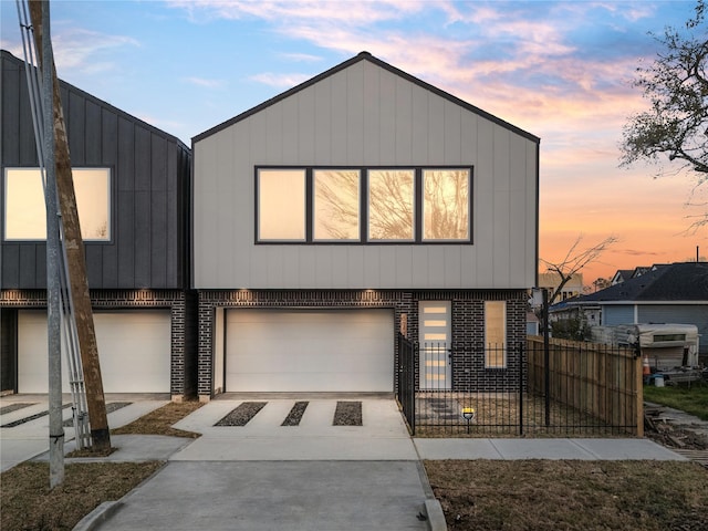 6907 Conley St, Houston, TX 77021 - view of front of home with brick siding, an attached garage, and concrete driveway