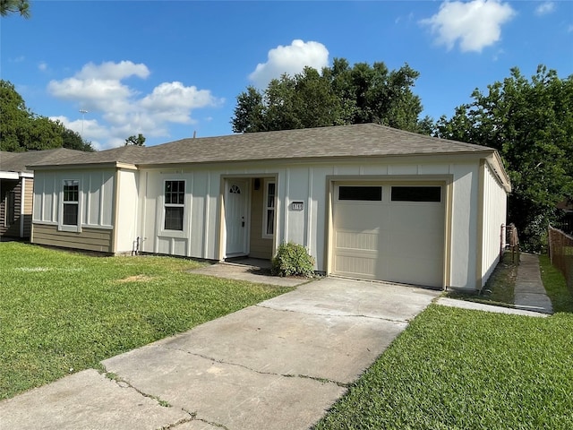 8766 Flossie Mae St, Houston, TX 77029 - ranch-style home featuring a front yard, driveway, a shingled roof, an attached garage, and board and batten siding