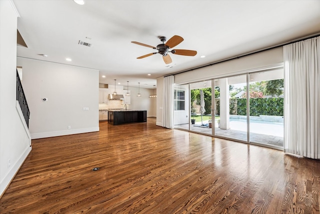 1901 Woodcrest Dr, Houston, TX 77018 - unfurnished living room with recessed lighting, dark wood-style floors, and a ceiling fan