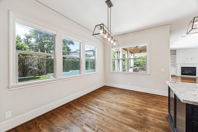 1901 Woodcrest Dr, Houston, TX 77018 - unfurnished dining area featuring plenty of natural light and wood finished floors