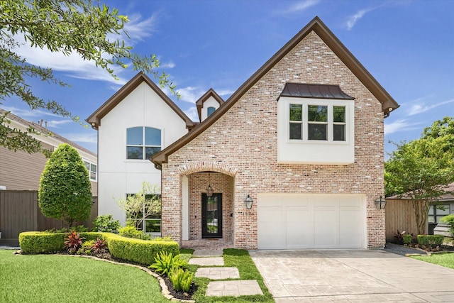 1901 Woodcrest Dr, Houston, TX 77018 - view of front of home featuring an attached garage, driveway, brick siding, and stucco siding