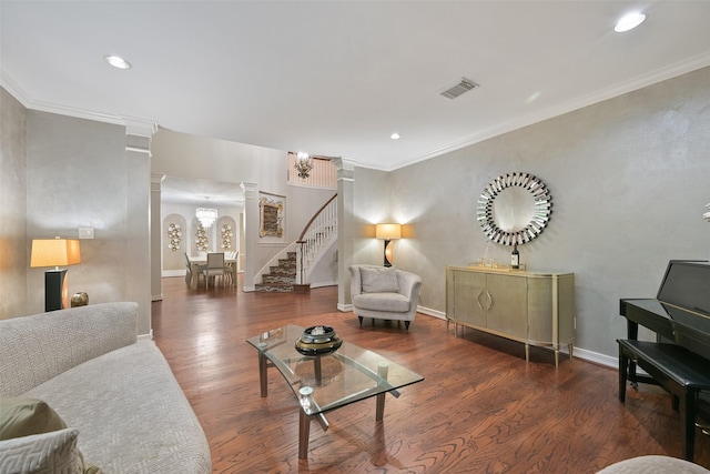15431 Greens Cove Way, Houston, TX 77059 - living area featuring ornate columns, wood finished floors, stairway, recessed lighting, and ornamental molding
