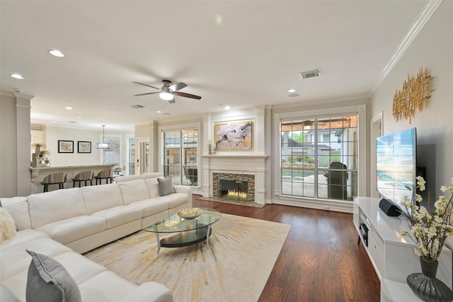 15431 Greens Cove Way, Houston, TX 77059 - living area featuring ornamental molding, a ceiling fan, dark wood-style flooring, a fireplace, and recessed lighting