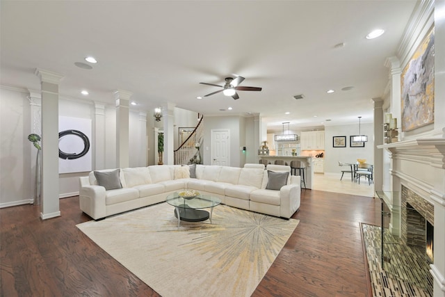 15431 Greens Cove Way, Houston, TX 77059 - living area featuring ceiling fan, ornate columns, recessed lighting, dark wood-style flooring, and ornamental molding