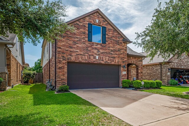 8113 E Pine Creek Bnd, Cypress, TX 77433 - view of front facade with an attached garage, brick siding, and concrete driveway