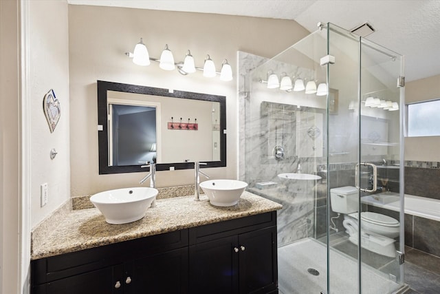 1018 Memorial Village Dr Unit 124, Houston, TX 77024 - full bath with double vanity, a stall shower, and lofted ceiling