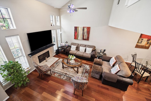 1018 Memorial Village Dr Unit 124, Houston, TX 77024 - living area with plenty of natural light, wood finished floors, a ceiling fan, and high vaulted ceiling