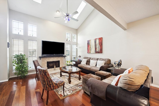 1018 Memorial Village Dr Unit 124, Houston, TX 77024 - living room featuring high vaulted ceiling, a fireplace, a ceiling fan, and dark wood-style floors