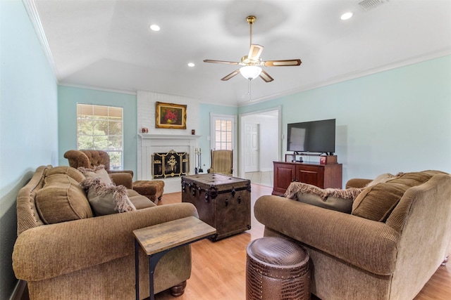 1418 Louisiana Ave, Pasadena, TX 77536 - living area featuring crown molding, light wood-type flooring, ceiling fan, a large fireplace, and recessed lighting