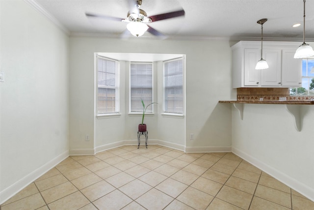 1418 Louisiana Ave, Pasadena, TX 77536 - unfurnished dining area with ceiling fan, light tile patterned floors, and ornamental molding
