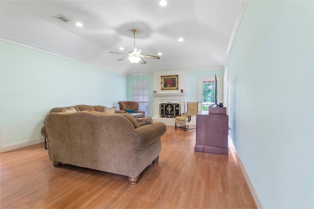 1418 Louisiana Ave, Pasadena, TX 77536 - living area with crown molding, light wood-type flooring, a ceiling fan, recessed lighting, and a fireplace with raised hearth