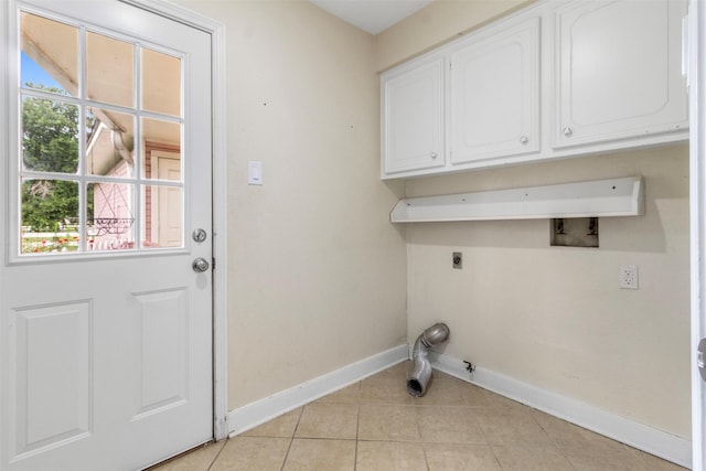 1418 Louisiana Ave, Pasadena, TX 77536 - laundry area with cabinet space, hookup for an electric dryer, light tile patterned floors, and hookup for a washing machine