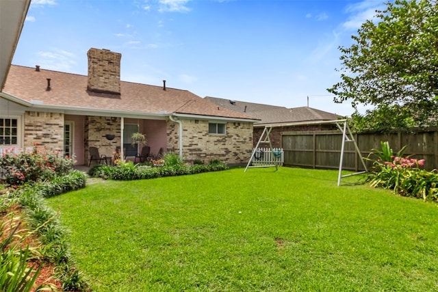 1418 Louisiana Ave, Pasadena, TX 77536 - back of property featuring a chimney, brick siding, and a shingled roof