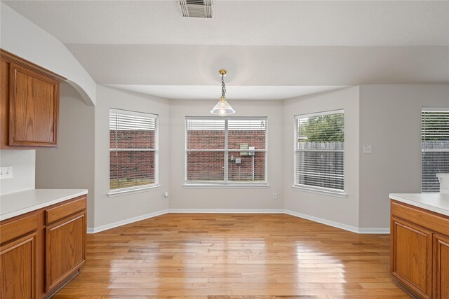 22910 Bank Shade Ct, Tomball, TX 77375 - unfurnished dining area featuring light wood-type flooring and plenty of natural light