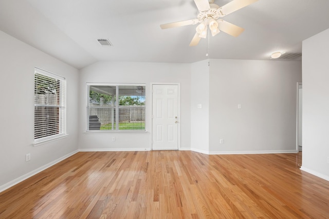 22910 Bank Shade Ct, Tomball, TX 77375 - spare room featuring light wood-type flooring, a ceiling fan, and vaulted ceiling