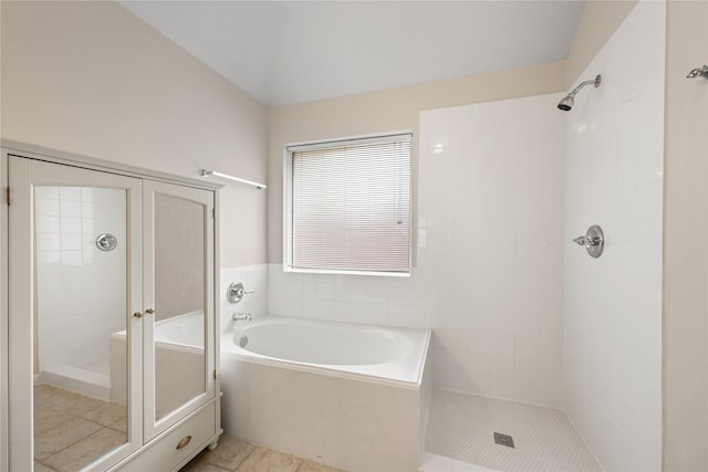 22910 Bank Shade Ct, Tomball, TX 77375 - bathroom featuring a stall shower, a bath, and tile patterned flooring
