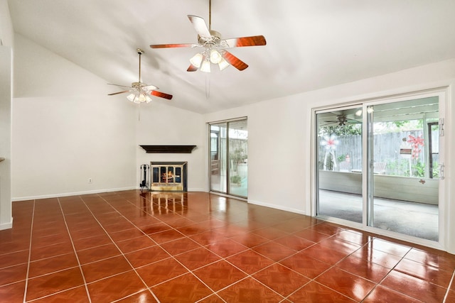 4103 Bugle Rd, Houston, TX 77072 - unfurnished living room featuring a ceiling fan, dark tile patterned floors, a glass covered fireplace, and high vaulted ceiling
