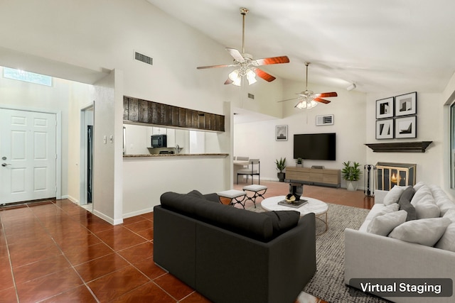 4103 Bugle Rd, Houston, TX 77072 - living room featuring high vaulted ceiling, ceiling fan, and dark tile patterned flooring