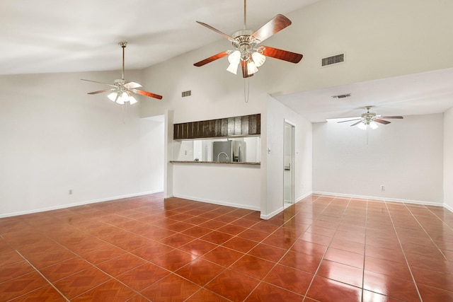 4103 Bugle Rd, Houston, TX 77072 - unfurnished living room featuring a ceiling fan, high vaulted ceiling, and dark tile patterned flooring
