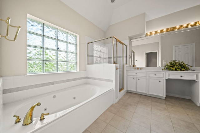 1931 Woodbury St, Houston, TX 77030 - bathroom featuring vanity, a jetted tub, a shower stall, tile patterned flooring, and vaulted ceiling