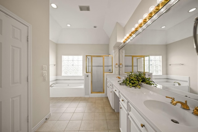 1931 Woodbury St, Houston, TX 77030 - bathroom featuring a garden tub, a shower stall, double vanity, lofted ceiling, and tile patterned flooring