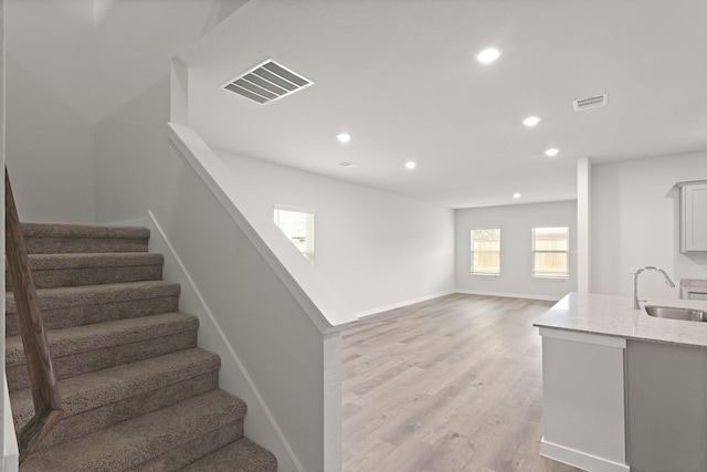 436 Shoreview Dr, Conroe, TX 77303 - stairway with recessed lighting and wood finished floors