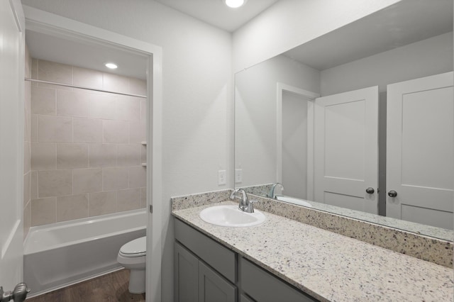 436 Shoreview Dr, Conroe, TX 77303 - bathroom featuring vanity, wood finished floors, shower / bathtub combination, and recessed lighting
